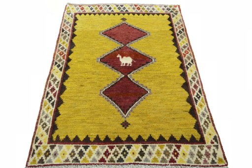 Surface texture of 2000s Persian Gabbeh rug with natural Wool and intricate pattern