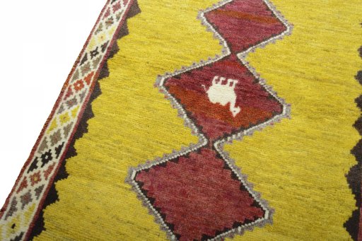 Backside of handmade 2000s Persian Gabbeh rug showing knot structure and weave density