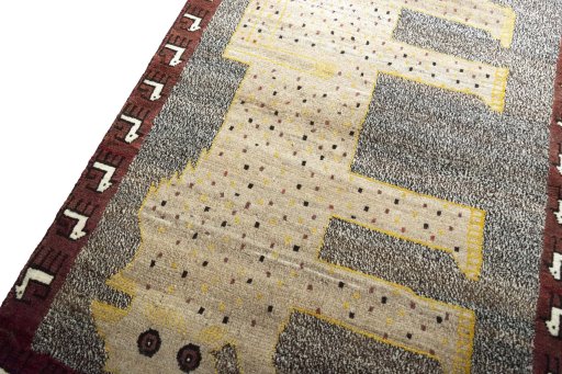 Backside of handmade 2000s Persian Gabbeh rug showing knot structure and weave density