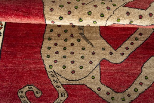 Full view of 2000s Persian Gabbeh rug from Iran / Persia, 146 × 99 cm in Red tones