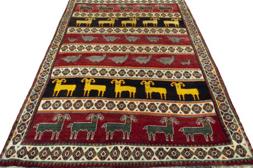 Surface texture of 2000s Persian Gabbeh rug with natural Wool and intricate pattern