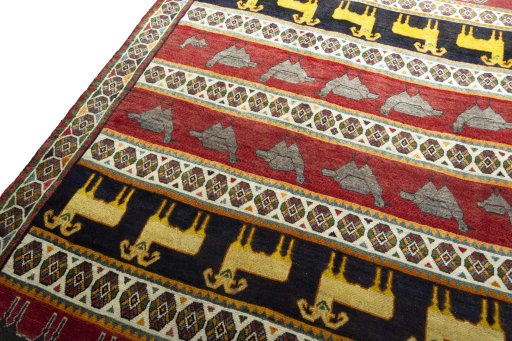 Backside of handmade 2000s Persian Gabbeh rug showing knot structure and weave density