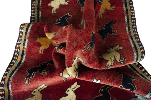 Corner detail of 2000s Persian Gabbeh rug showing border pattern and Wool pile