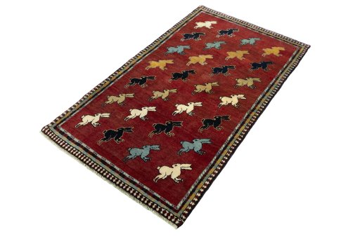 Corner detail of 2000s Persian Gabbeh rug showing border pattern and Wool pile