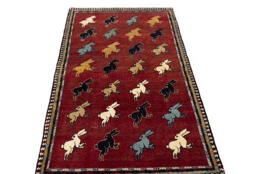 Surface texture of 2000s Persian Gabbeh rug with natural Wool and intricate pattern