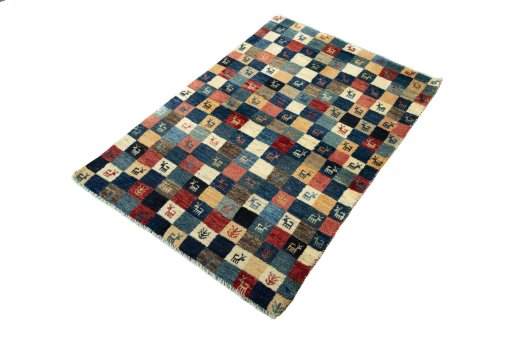 Corner detail of 2000s Persian Gabbeh rug showing border pattern and Wool pile