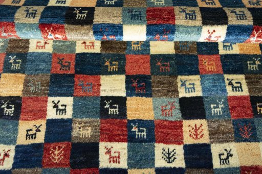 Full view of 2000s Persian Gabbeh rug from Iran / Persia, 146 × 103 cm in Multi Color tones