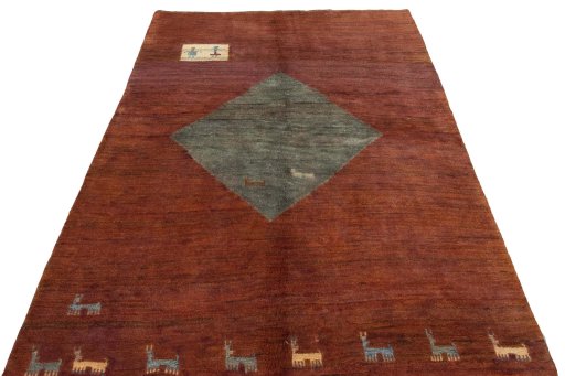 Surface texture of 2000s Persian Gabbeh rug with natural Wool and intricate pattern