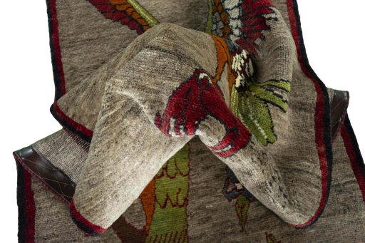 Corner detail of 2000s Persian Gabbeh rug showing border pattern and Wool pile