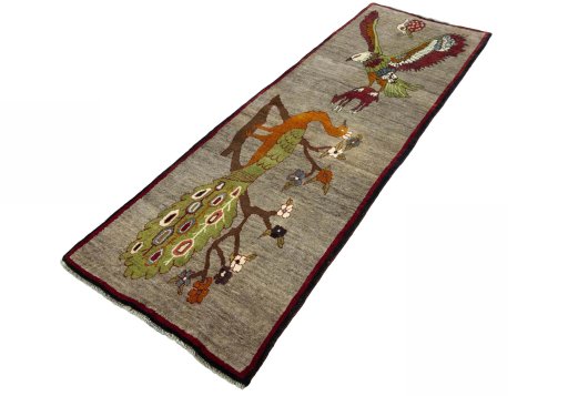 Corner detail of 2000s Persian Gabbeh rug showing border pattern and Wool pile