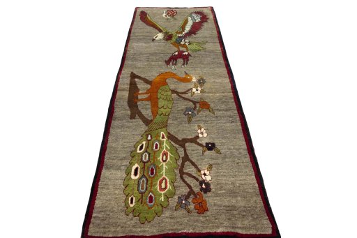 Surface texture of 2000s Persian Gabbeh rug with natural Wool and intricate pattern