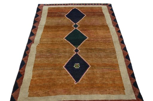 Surface texture of 2000s Persian Gabbeh rug with natural Wool and intricate pattern