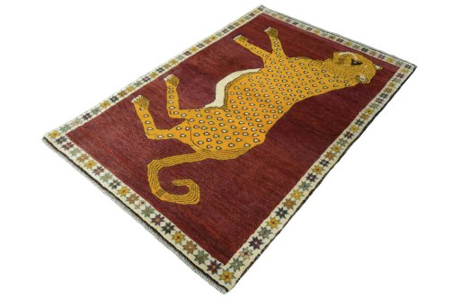 Corner detail of 2000s Persian Gabbeh rug showing border pattern and Wool pile