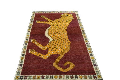 Surface texture of 2000s Persian Gabbeh rug with natural Wool and intricate pattern