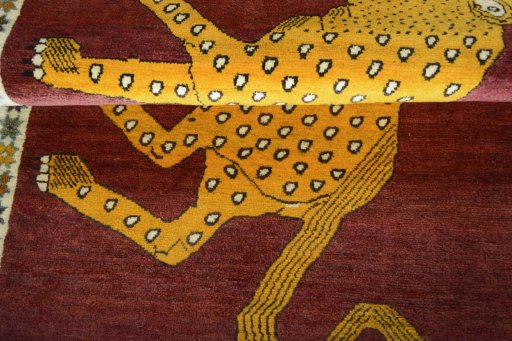 Full view of 2000s Persian Gabbeh rug from Iran / Persia, 185 × 117 cm in Red tones