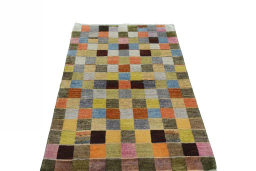 Surface texture of 2000s Persian Gabbeh rug with natural Wool and intricate pattern