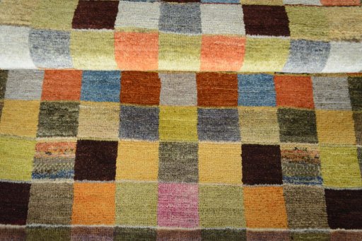 Full view of 2000s Persian Gabbeh rug from Iran / Persia, 141 × 96 cm in Multi Color tones