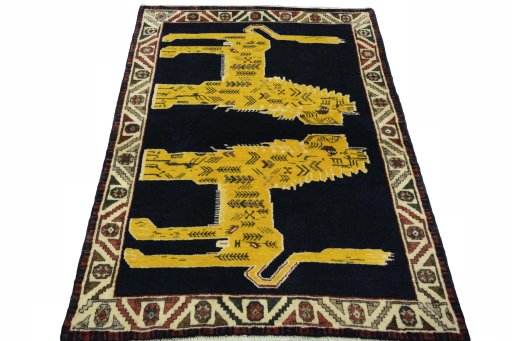 Surface texture of 2000s Persian Gabbeh rug with natural Wool and intricate pattern