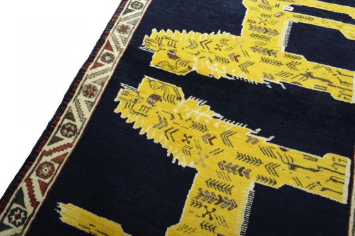 Backside of handmade 2000s Persian Gabbeh rug showing knot structure and weave density