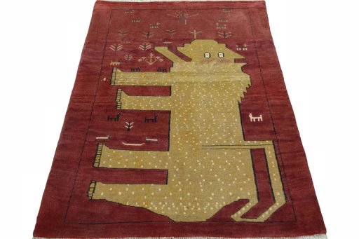 Surface texture of 2000s Persian Gabbeh rug with natural Wool and intricate pattern