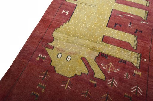 Backside of handmade 2000s Persian Gabbeh rug showing knot structure and weave density