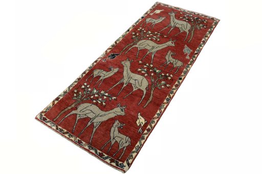 Corner detail of 2000s Persian Gabbeh rug showing border pattern and Wool pile
