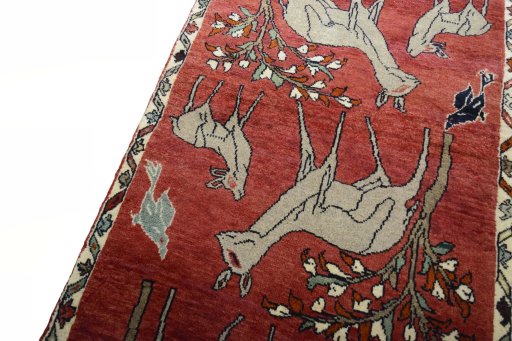 Backside of handmade 2000s Persian Gabbeh rug showing knot structure and weave density