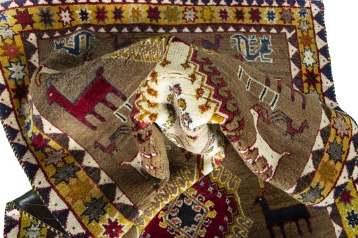 Corner detail of 2000s Persian Gabbeh rug showing border pattern and Wool pile