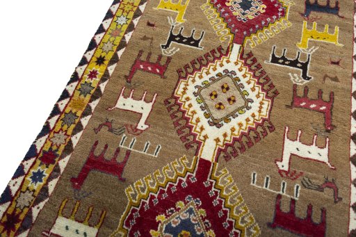 Backside of handmade 2000s Persian Gabbeh rug showing knot structure and weave density