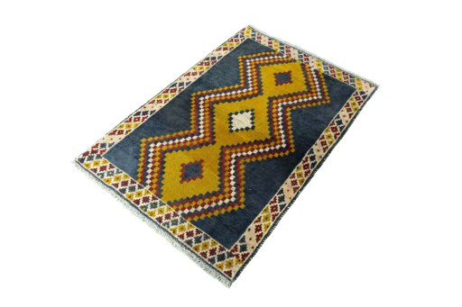 Corner detail of 2000s Persian Gabbeh rug showing border pattern and Wool pile