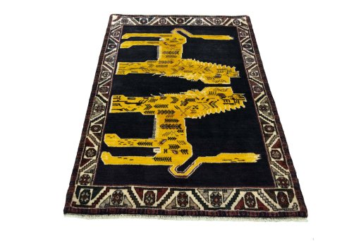 Surface texture of 2000s Persian Gabbeh rug with natural Wool and intricate pattern