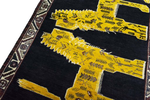 Backside of handmade 2000s Persian Gabbeh rug showing knot structure and weave density