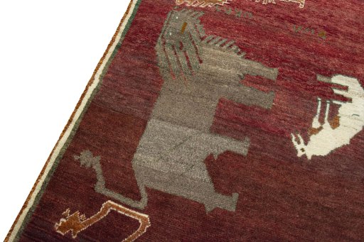 Backside of handmade 2000s Persian Gabbeh rug showing knot structure and weave density