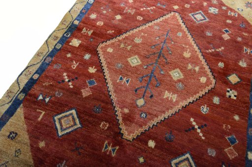 Backside of handmade 2000s Persian Gabbeh rug showing knot structure and weave density