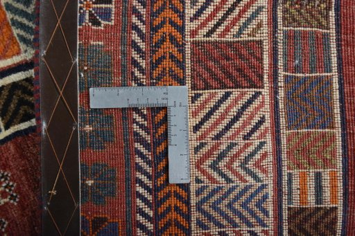 Surface texture of 2000s Persian Gabbeh rug with natural Wool and intricate pattern