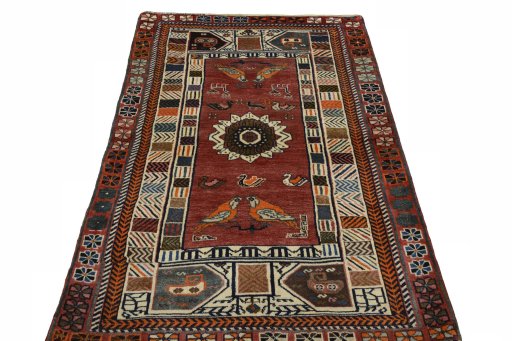 Surface texture of 2000s Persian Gabbeh rug with natural Wool and intricate pattern