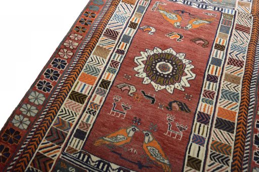 Backside of handmade 2000s Persian Gabbeh rug showing knot structure and weave density