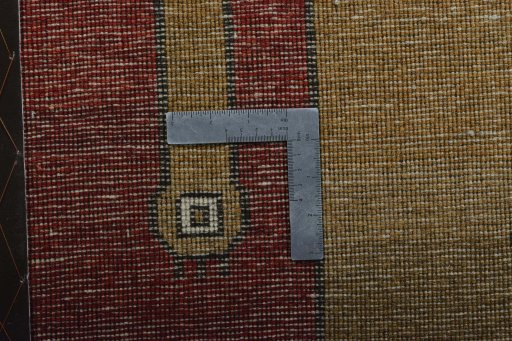 Corner detail of 2000s Persian Gabbeh rug showing border pattern and Wool pile