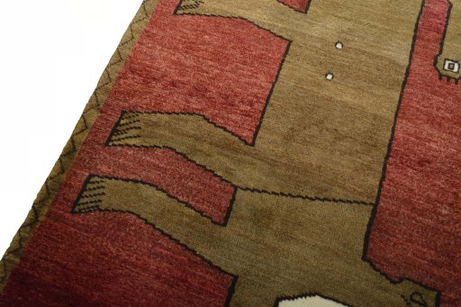Backside of handmade 2000s Persian Gabbeh rug showing knot structure and weave density