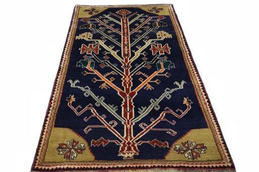 Surface texture of 2000s Persian Gabbeh rug with natural Wool and intricate pattern