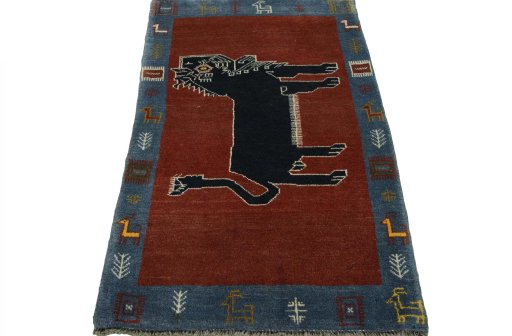 Surface texture of 2000s Persian Gabbeh rug with natural Wool and intricate pattern