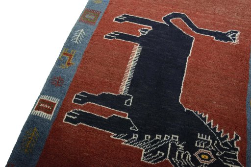 Backside of handmade 2000s Persian Gabbeh rug showing knot structure and weave density