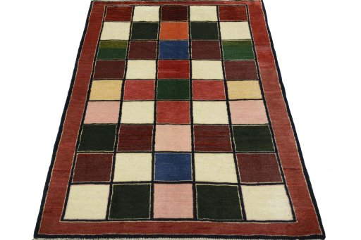 Surface texture of 2000s Persian Gabbeh rug with natural Wool and intricate pattern