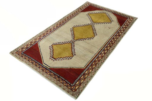 Corner detail of 2000s Persian Gabbeh rug showing border pattern and Wool pile