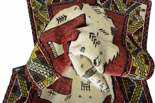 Corner detail of 2000s Persian Gabbeh rug showing border pattern and Wool pile
