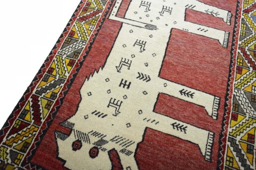 Backside of handmade 2000s Persian Gabbeh rug showing knot structure and weave density