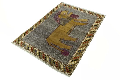 Corner detail of 2000s Persian Gabbeh rug showing border pattern and Wool pile