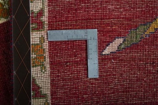 Corner detail of 2000s Persian Gabbeh rug showing border pattern and Wool pile