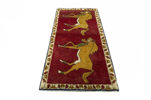 Surface texture of 2000s Persian Gabbeh rug with natural Wool and intricate pattern