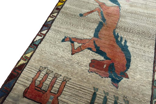 Backside of handmade 2000s Persian Gabbeh rug showing knot structure and weave density